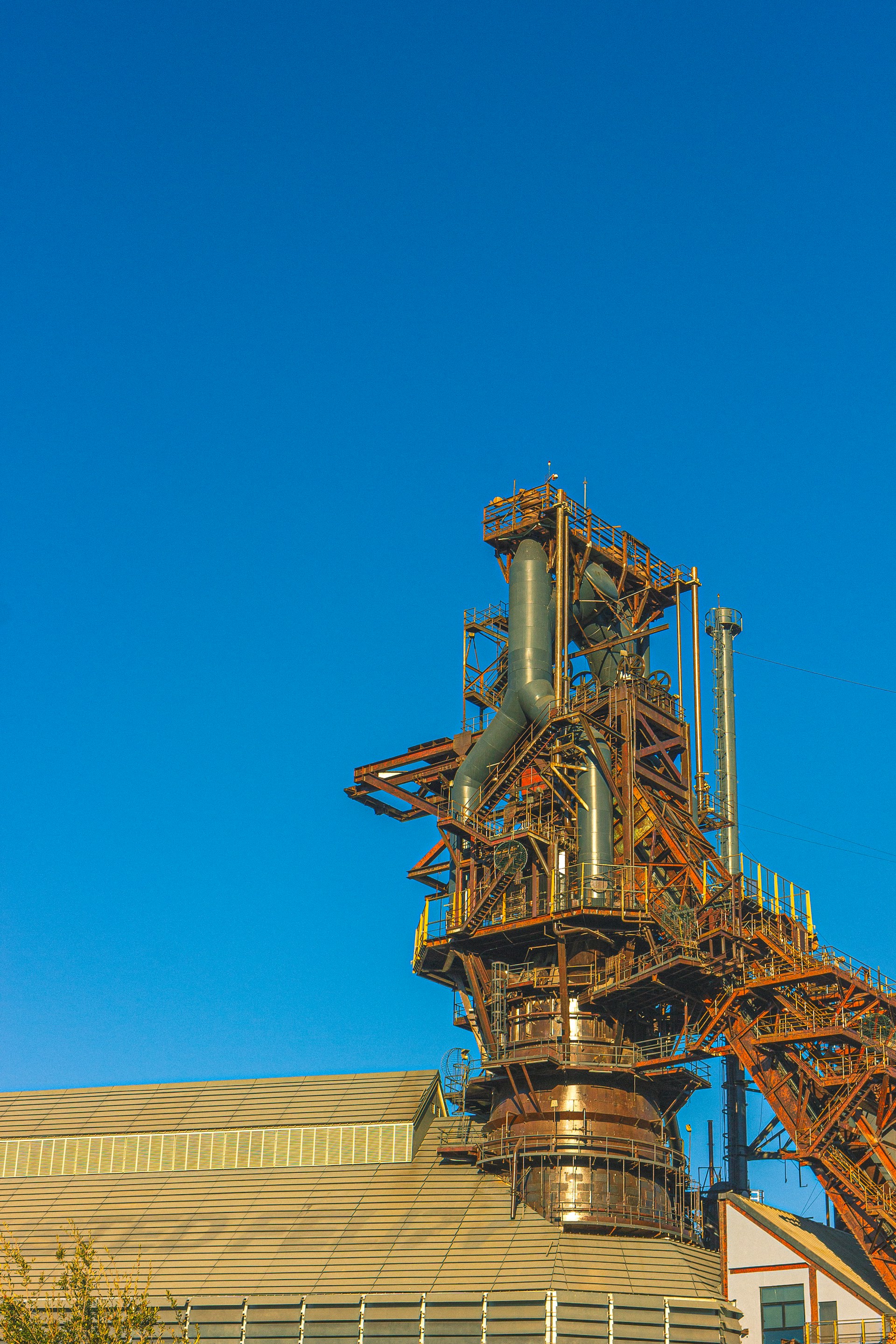 a building with a large metal structure on top of it