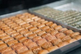 a close up of a tray of doughnuts