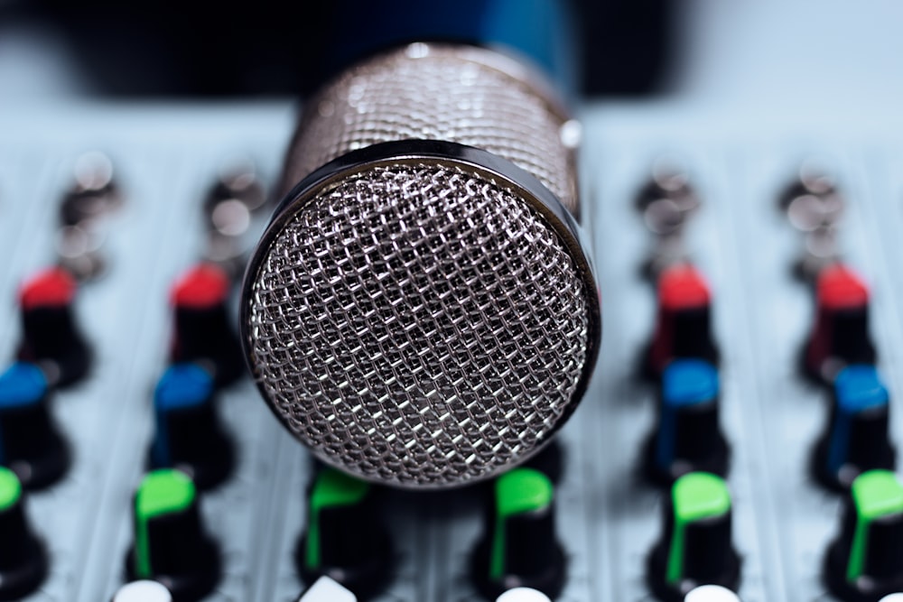 a microphone sitting on top of a sound board