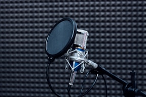 a microphone in front of a black background