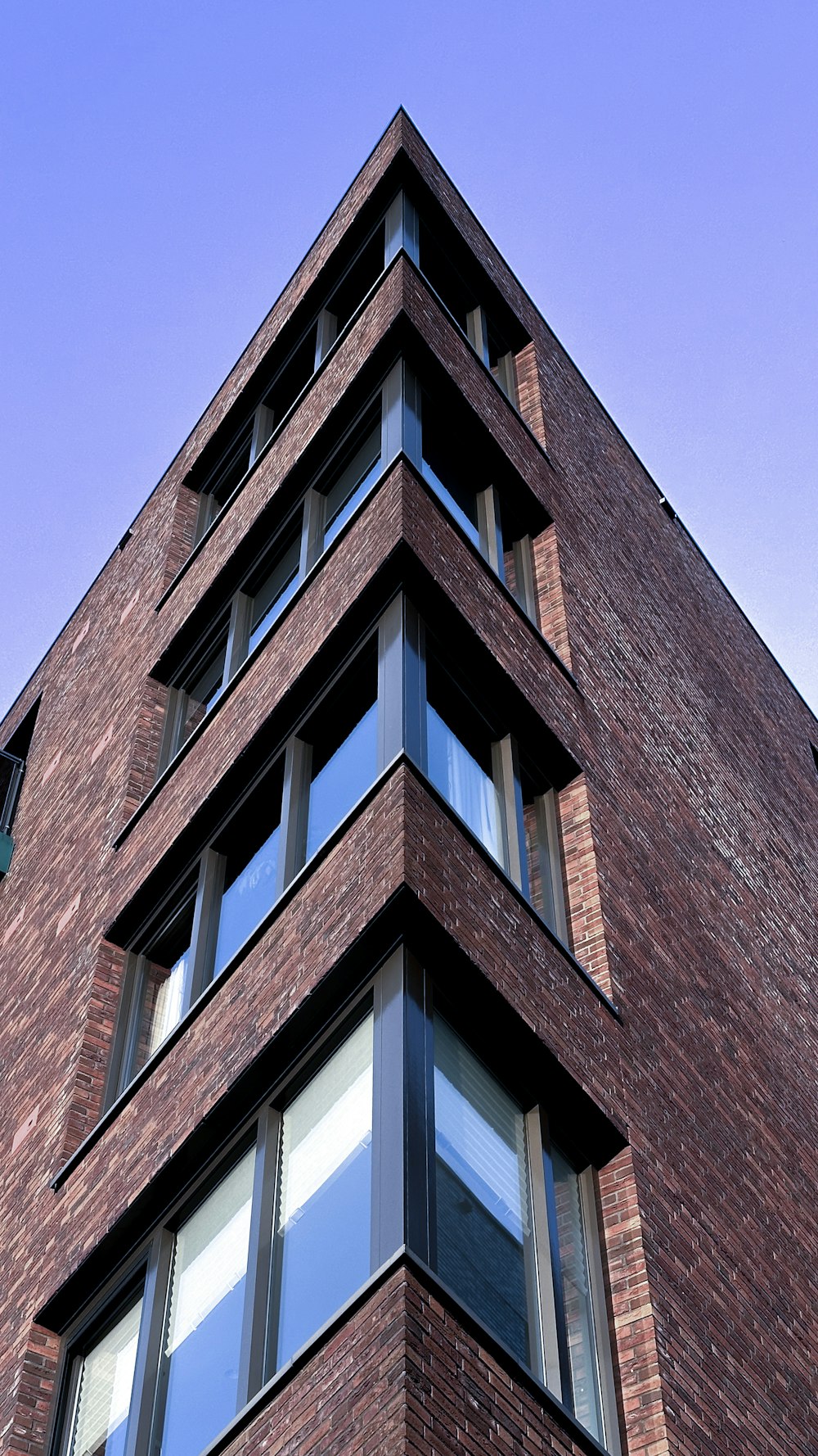 a tall brick building with lots of windows