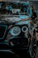 A luxury SUV sparkling clean, reflecting the clear blue sky, ready for the road.