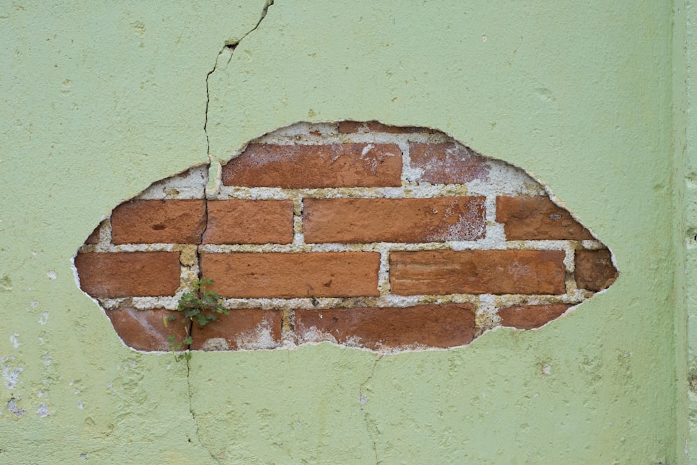 a brick wall with a hole in it