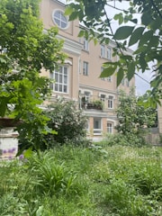 A completed residential building with a garden.