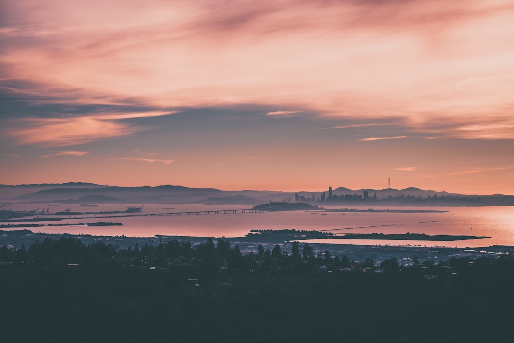 a view of a body of water with a city in the background