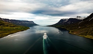 a boat traveling through a large body of water