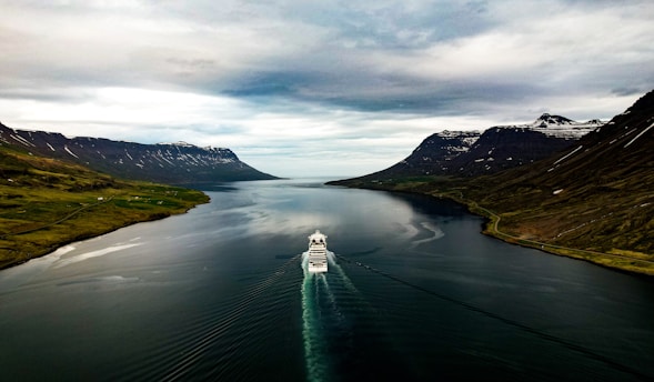 a boat traveling through a large body of water