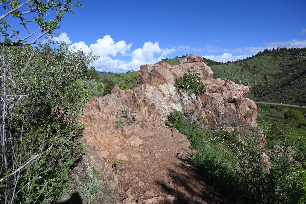 a dirt path in the middle of a mountain