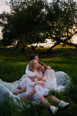 A serene group of women enjoying a peaceful moment together in a natural setting.
