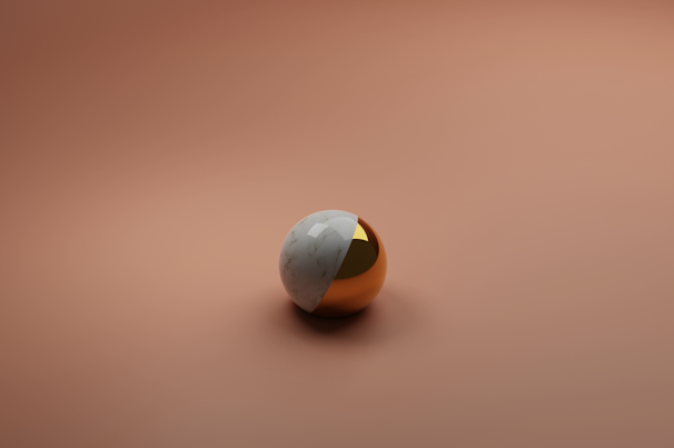 A minimalistic still life of a single copper sphere resting on a smooth white surface, illuminated by gentle light.