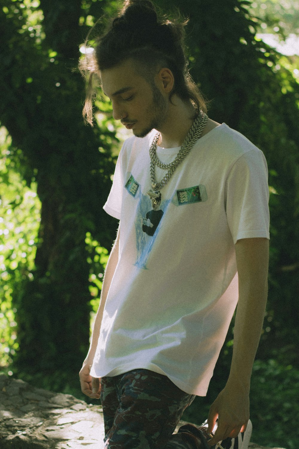 a young man with a skateboard in his hand