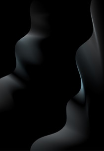 Abstract floating device with subtle gradient lighting, tilted diagonally in deep charcoal tones.