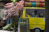 A vibrant display of various lemonade flavors in colorful cups.