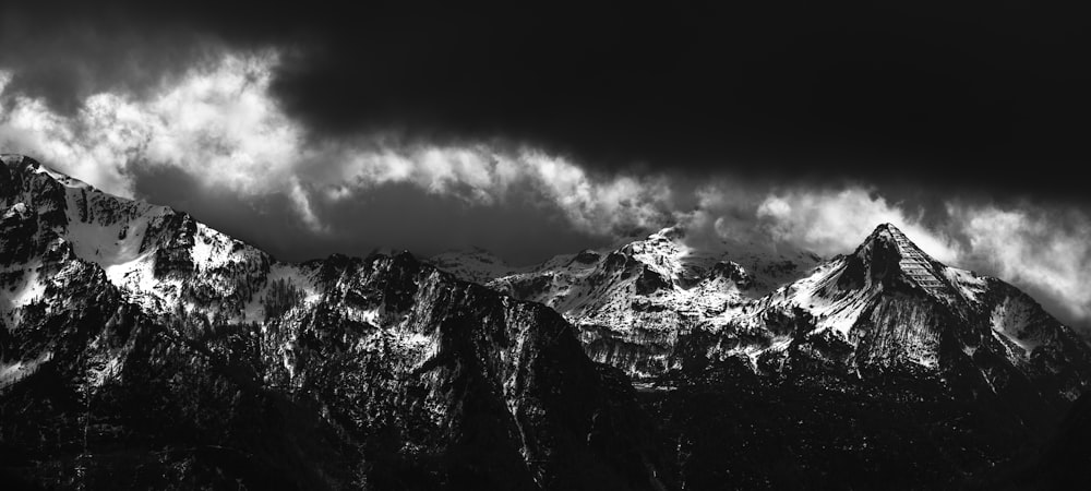 a black and white photo of a mountain range