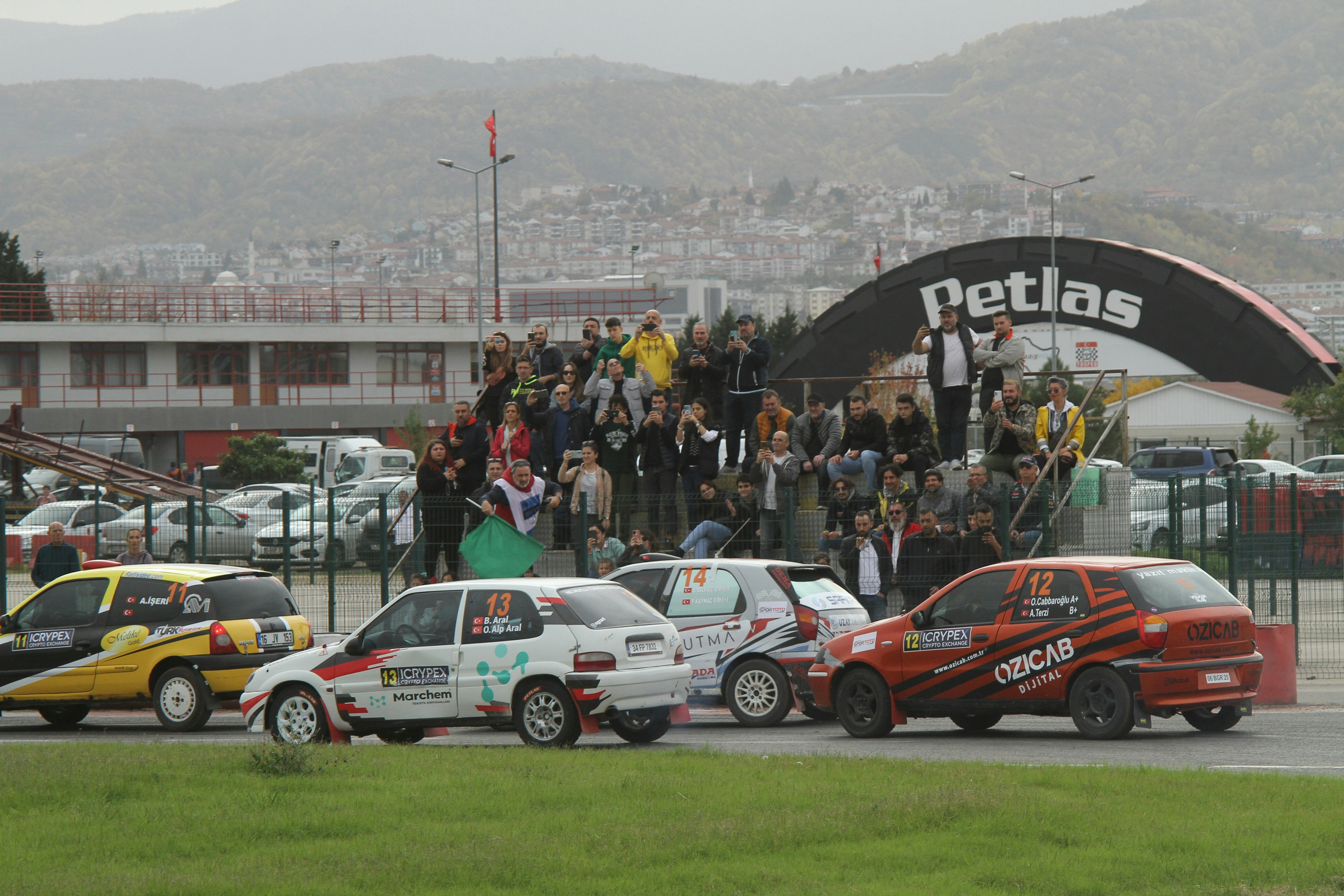 a group of cars parked next to each other in a parking lot