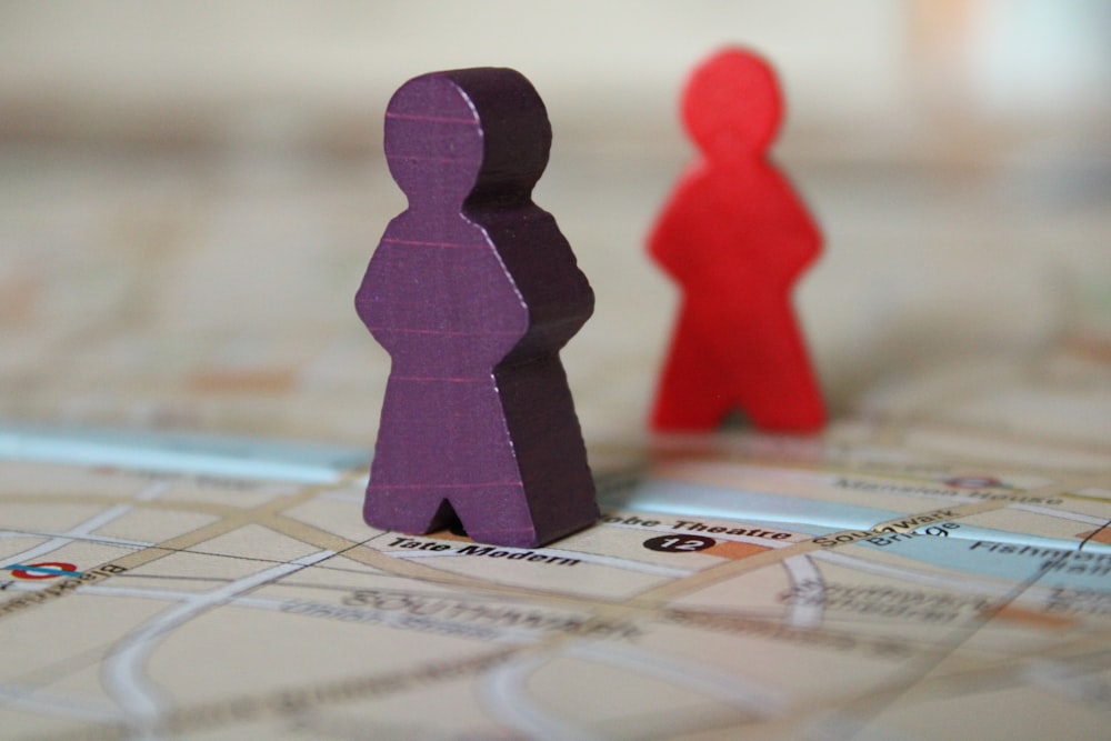 a close up of two people on a map