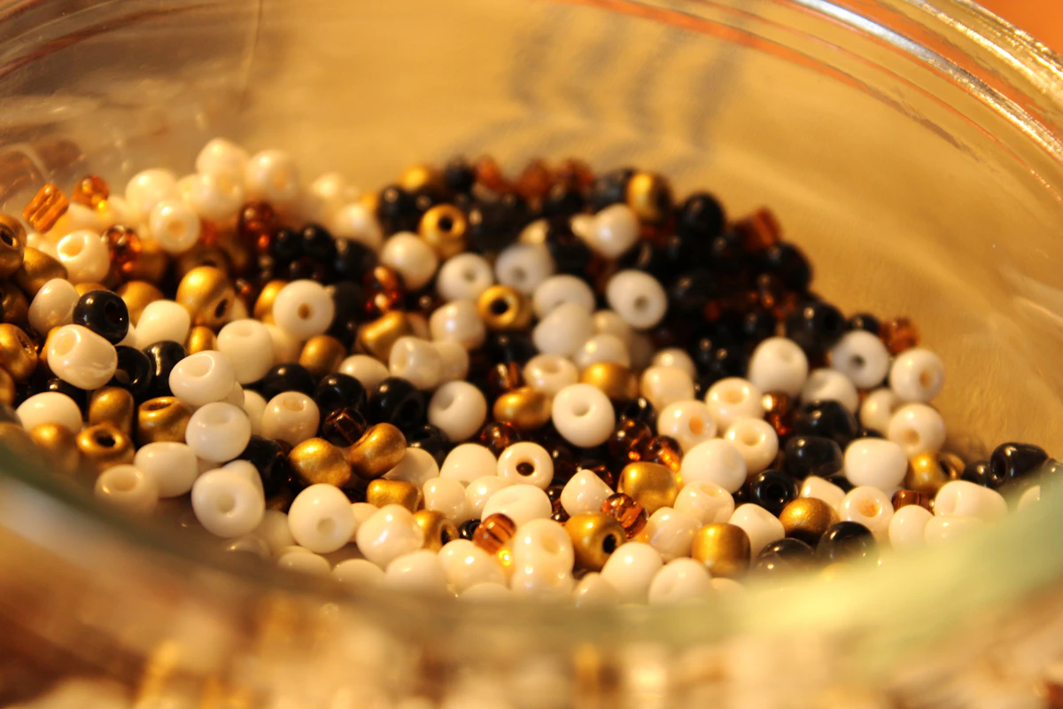 Black and white beads in a glass bowl