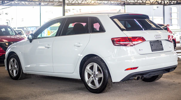 A side view of a well-kept hatchback, illustrating the variety of reliable vehicles available.