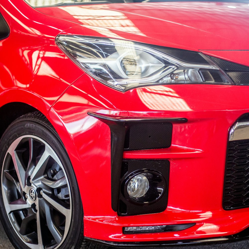 a red car parked on the side of the road