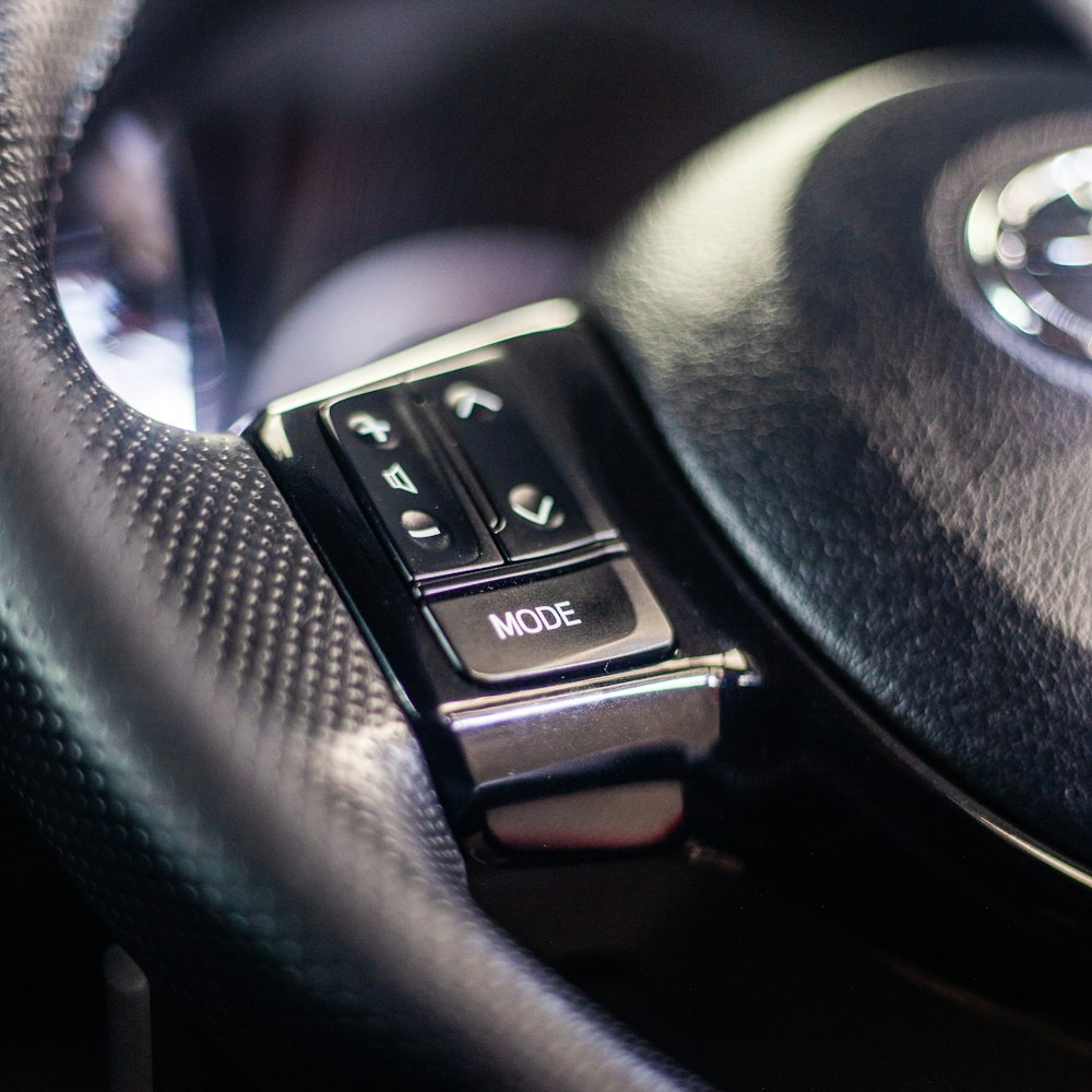 a close up of a steering wheel on a car