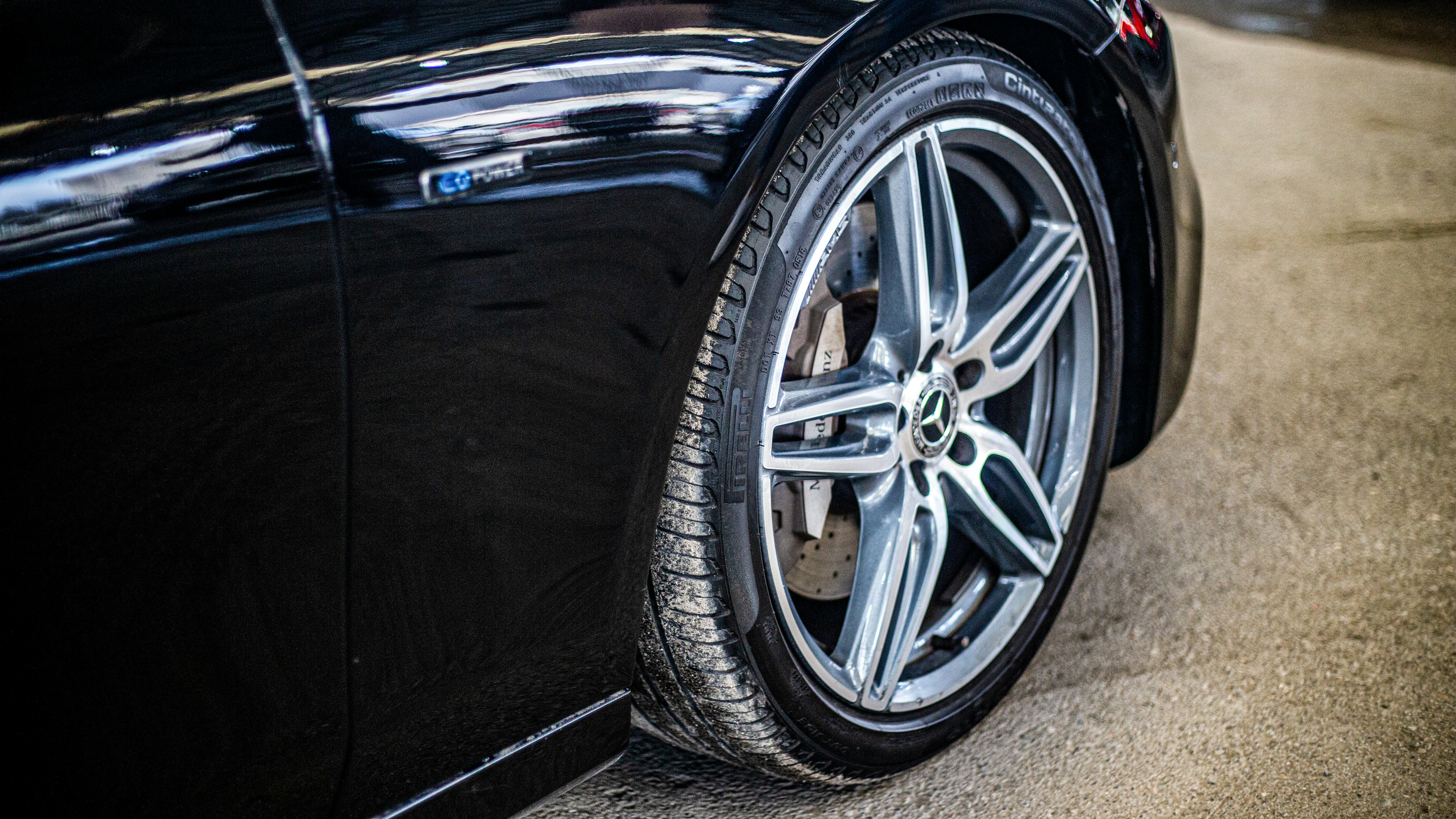 a close up of a car tire on a street
