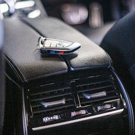 a car dashboard with a cell phone attached to it