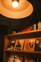 A cozy corner of the store featuring a professional vinyl cleaning station with records and tools laid out.