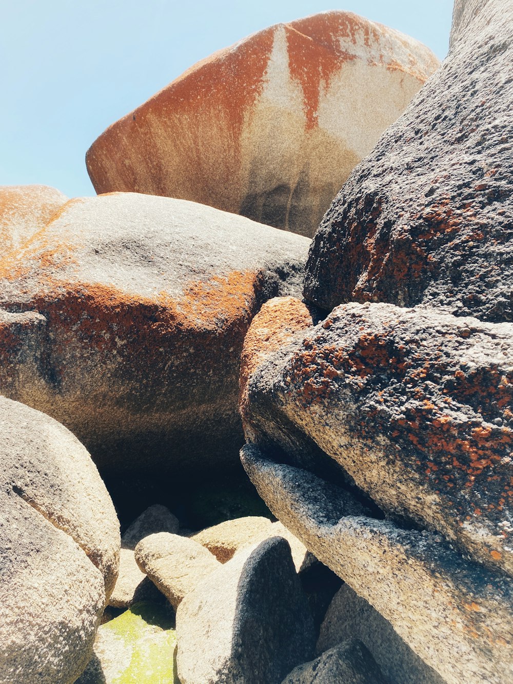 a close up of rocks with a sky in the background