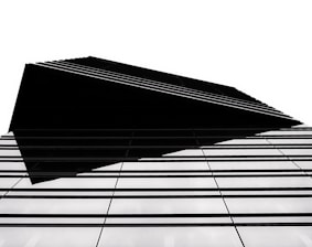 Black and white architectural structure with sharp lines symbolizing stability.