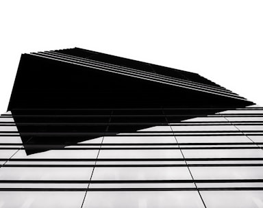 Black and white architectural structure with sharp lines symbolizing stability.