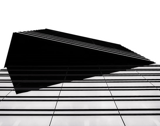 Modern architectural blueprint with clean black and cyan lines.