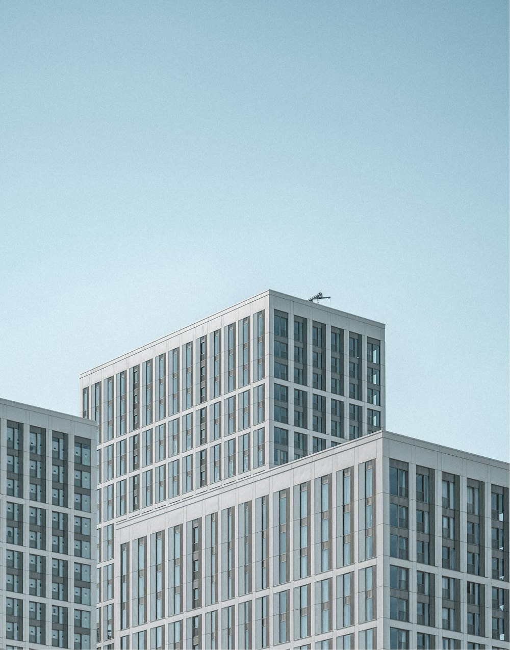 a tall building with a clock on the top of it