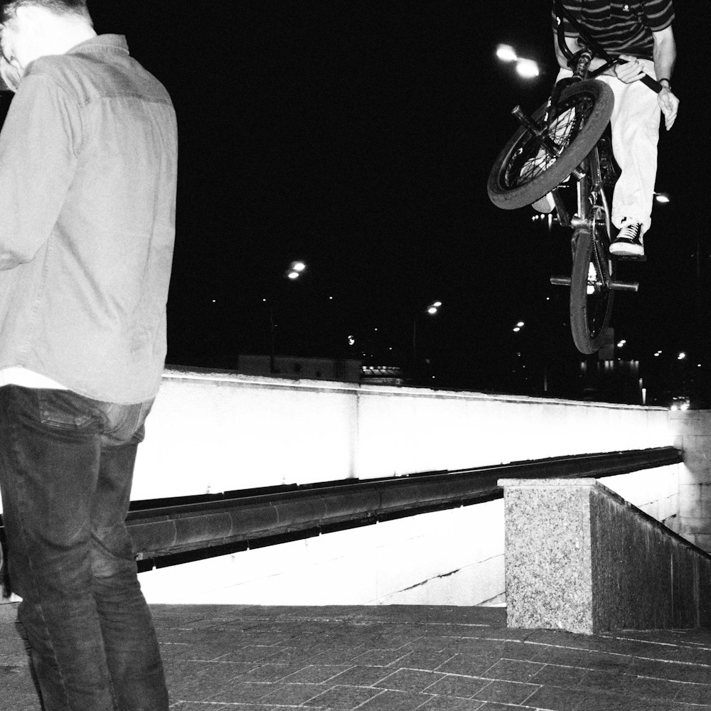 a man flying through the air while riding a skateboard