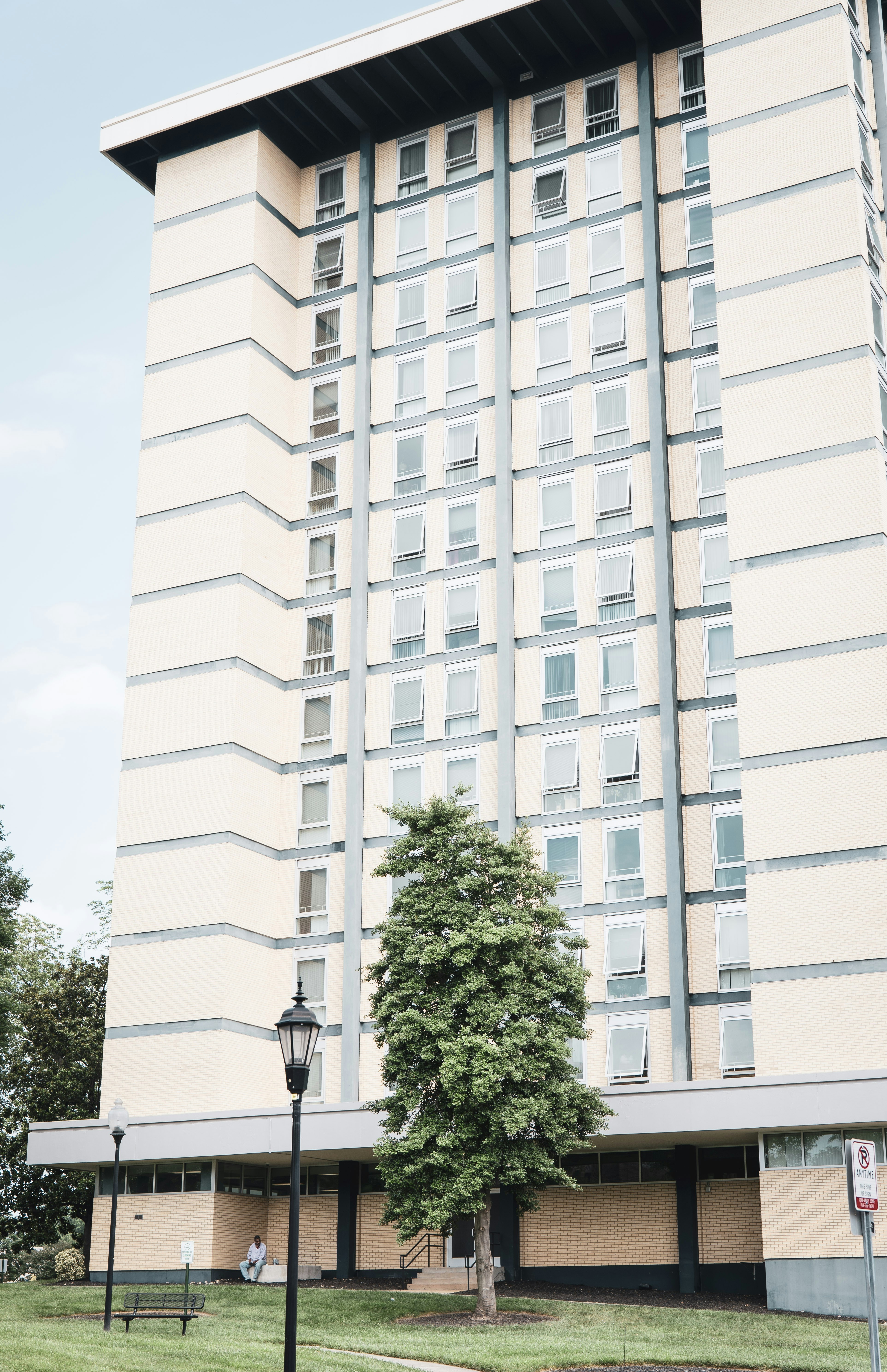 a tall building with a tree in front of it