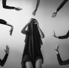 a group of people with their hands in the air