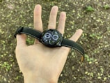 A model showcasing a sleek quantitative watch in an outdoor setting.