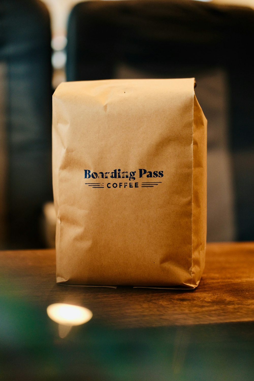 a bag of coffee sitting on top of a wooden table