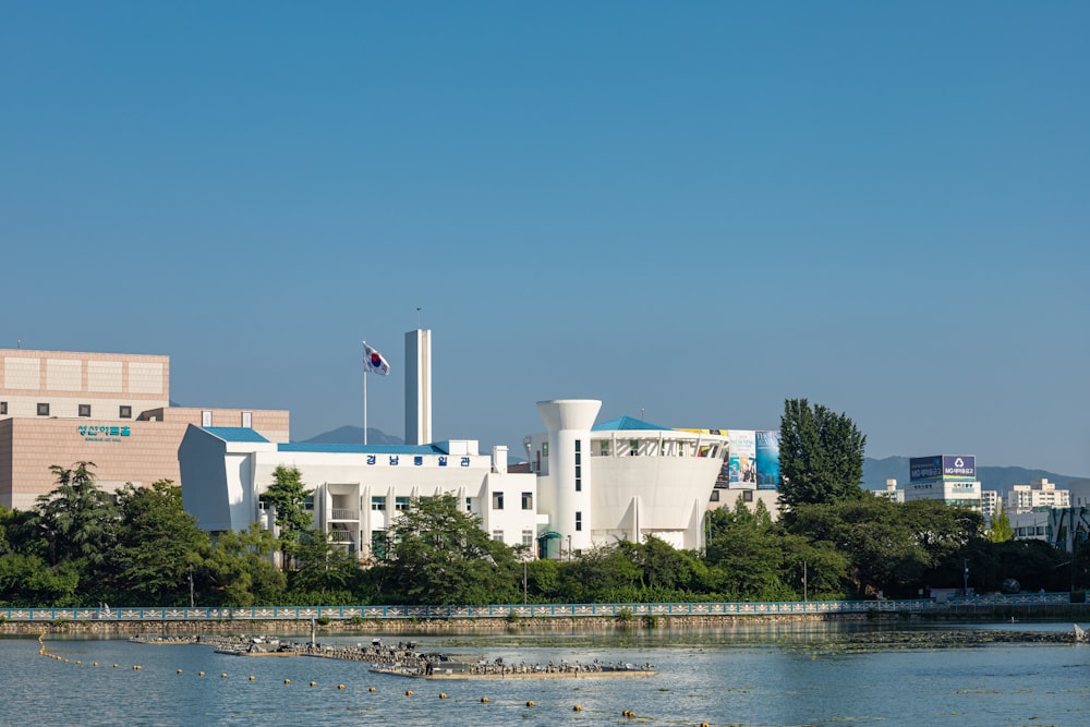 a large body of water with a building in the background