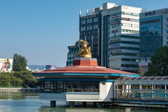 Golden dragon statue perched atop a Mahjong-themed casino game console.