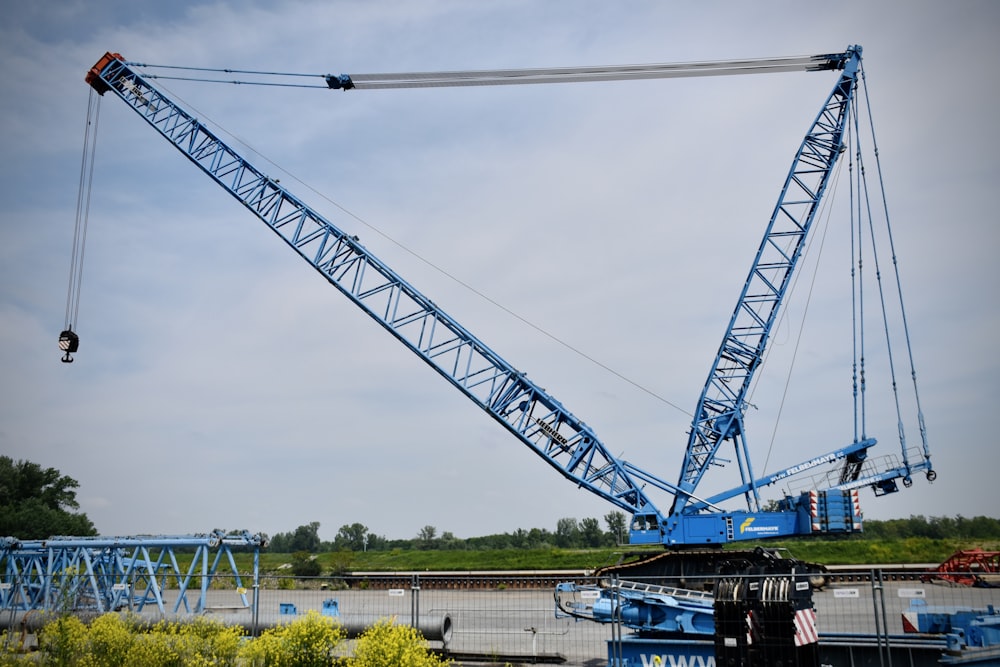 a large crane is lifting a piece of equipment