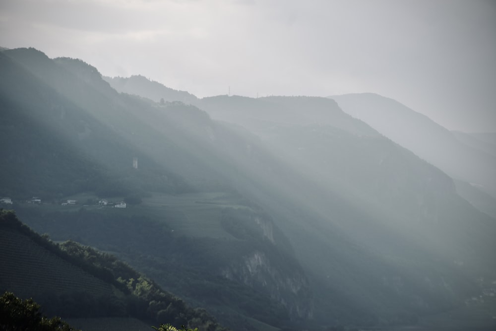 a view of a valley with mountains in the background