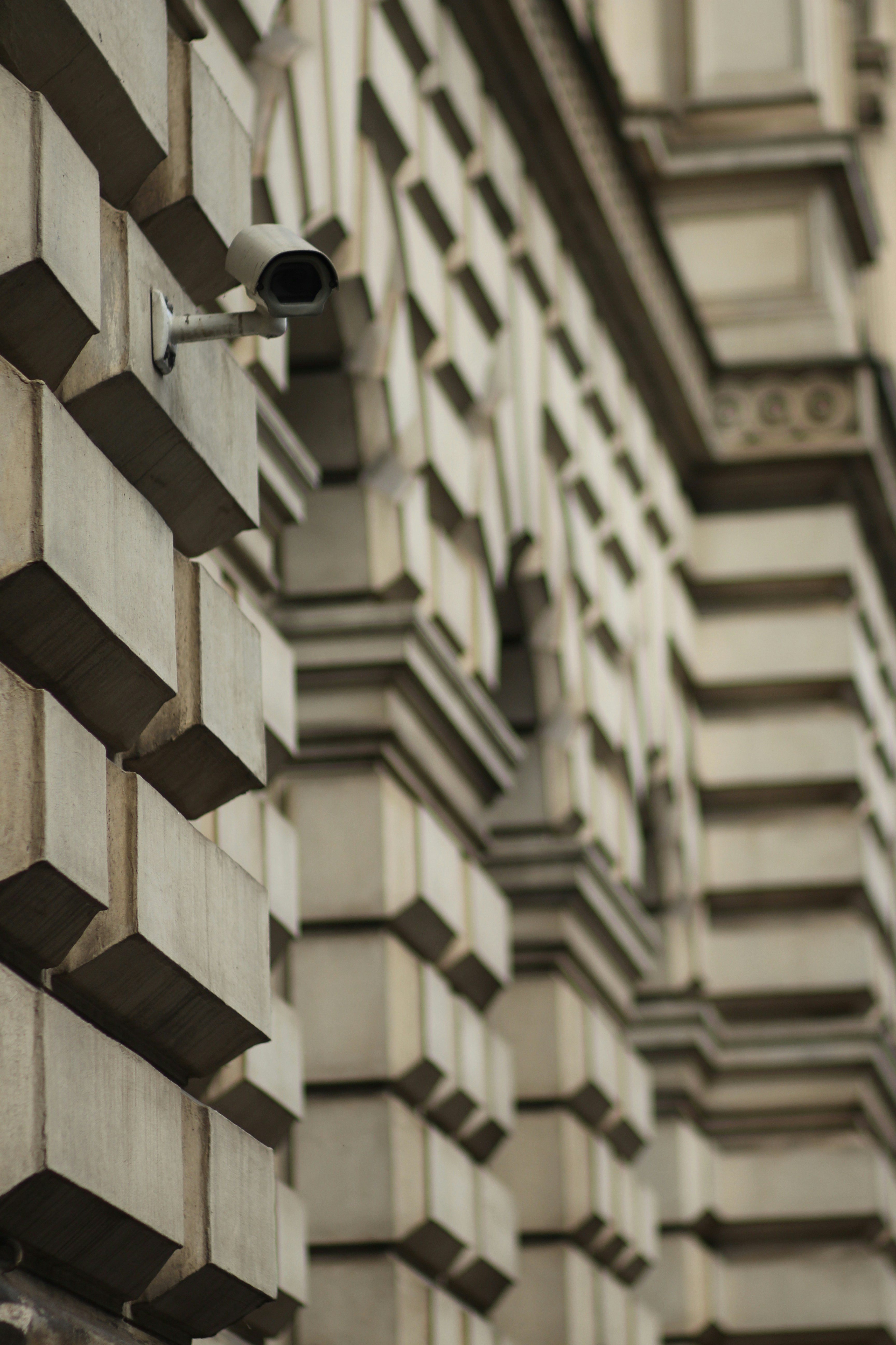 a security camera attached to the side of a building