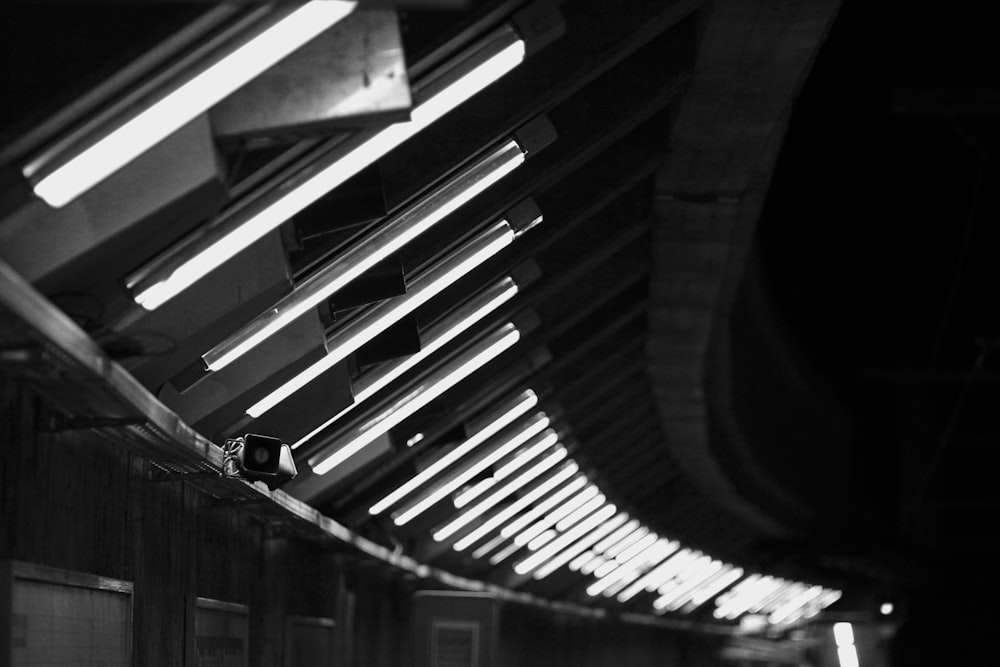 a black and white photo of a train station