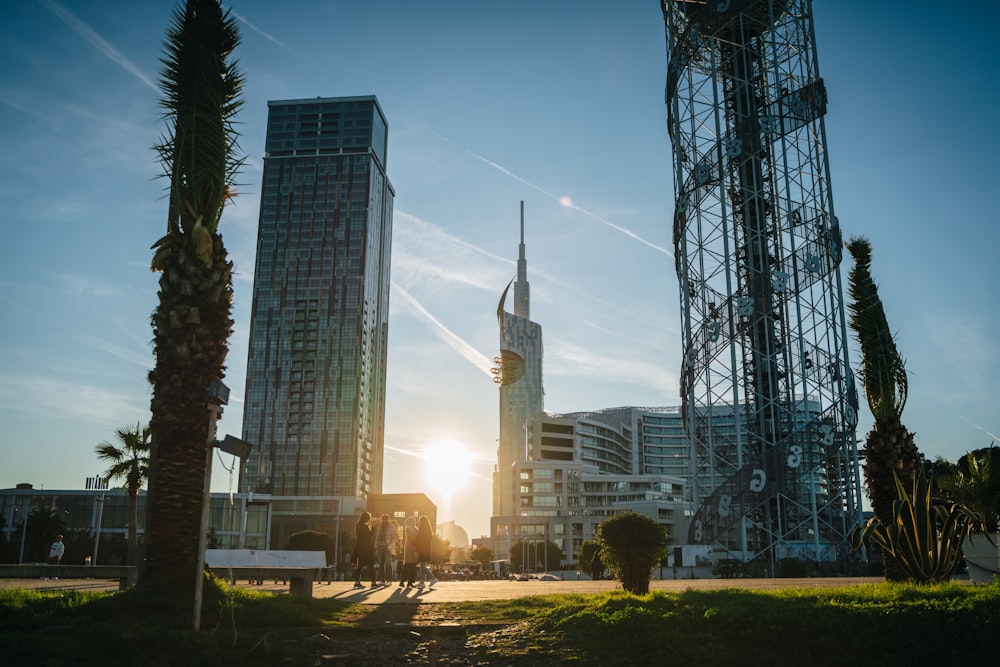 a couple of tall buildings sitting next to each other