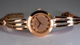 Elegant women's vintage watch featuring a delicate bracelet and intricate face design.