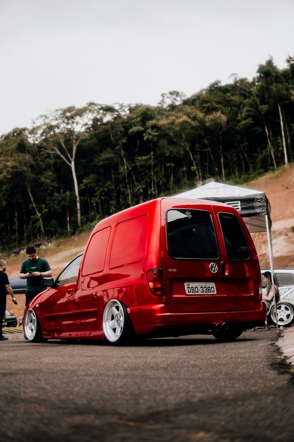 a red van parked on the side of a road