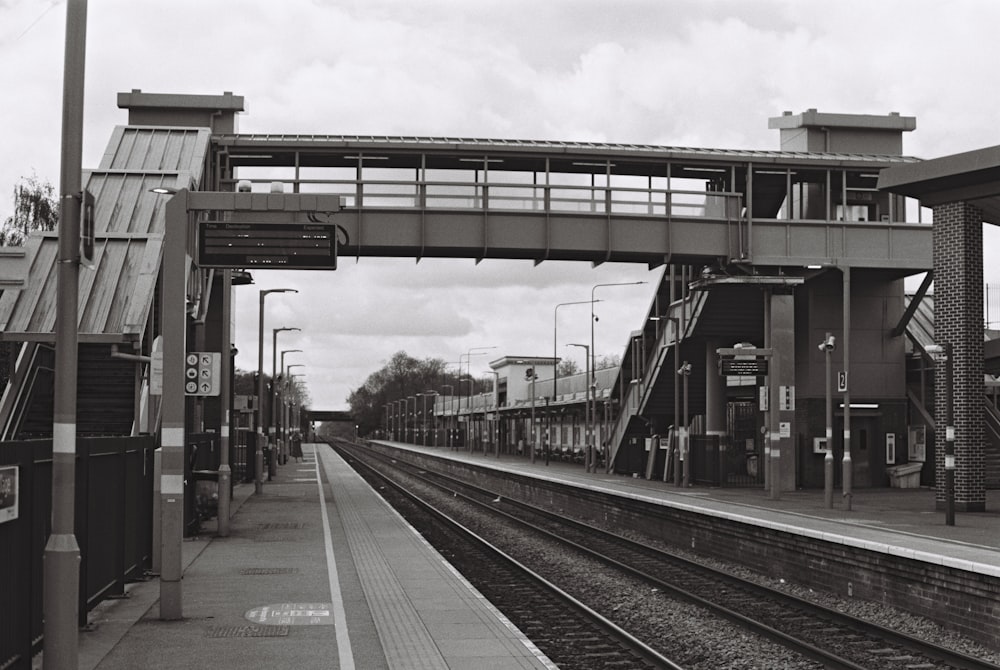 a black and white photo of a train station