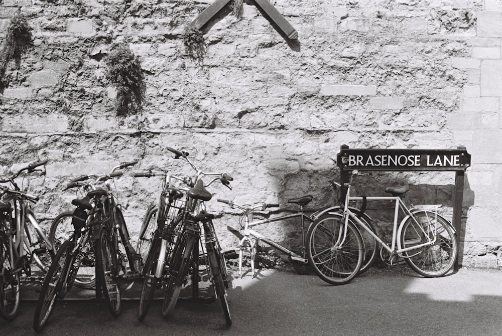 a black and white photo of a bunch of bikes