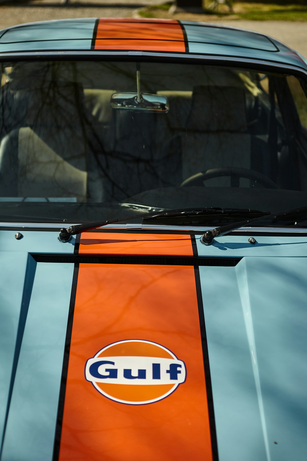 an orange and blue car with a gulf logo on it