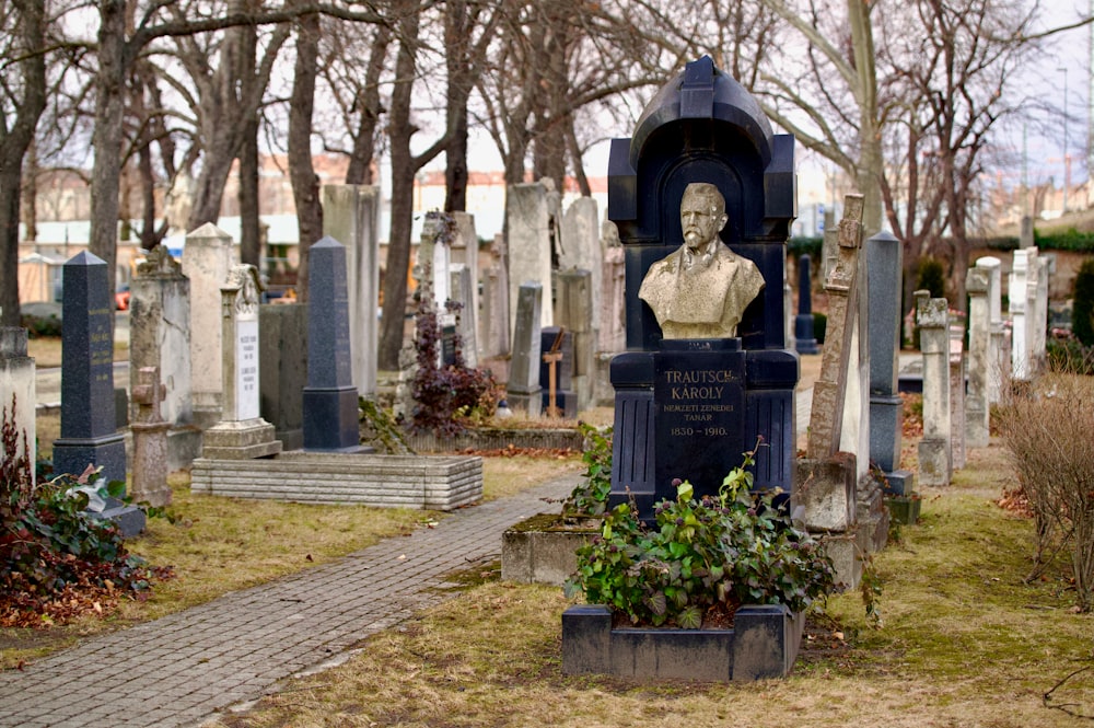 a cemetery with a bust of a man
